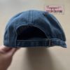 Distressed hat with adjustable back